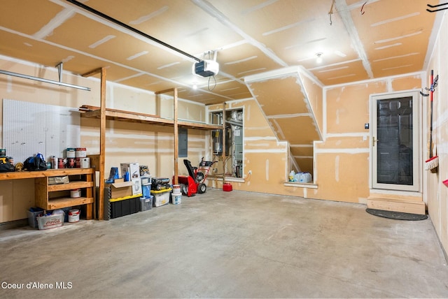 garage with electric panel and a garage door opener