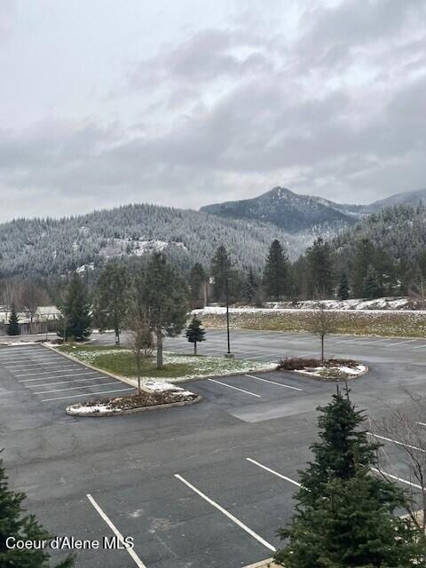 view of parking / parking lot with a mountain view