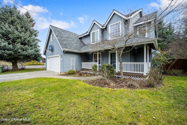 view of front of home featuring a front yard, a porch, and a garage