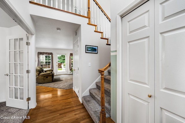 stairs featuring wood-type flooring