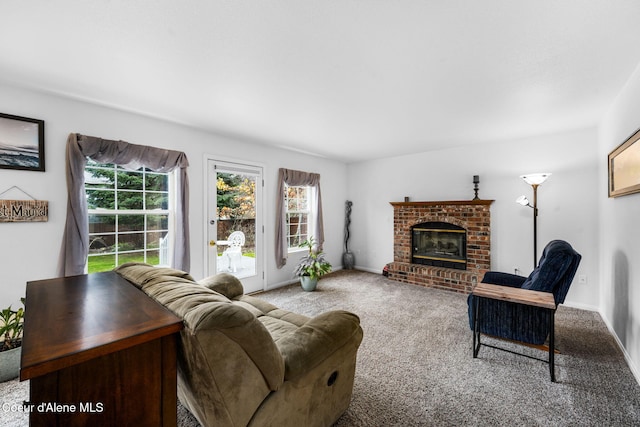 living room featuring carpet flooring and a fireplace