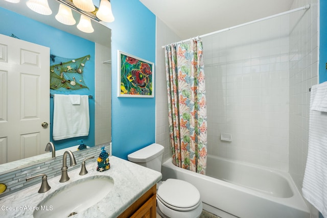 full bathroom featuring vanity, toilet, and shower / tub combo with curtain