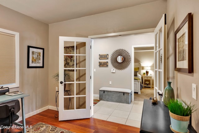 interior space with french doors and hardwood / wood-style floors