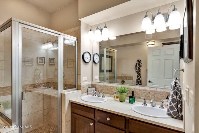 bathroom featuring vanity and an enclosed shower