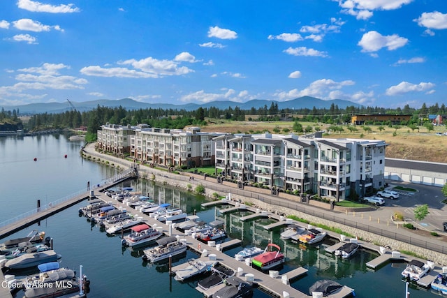 birds eye view of property featuring a water and mountain view