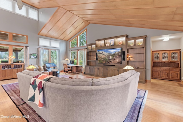 living room featuring light hardwood / wood-style flooring, wooden ceiling, and a high ceiling