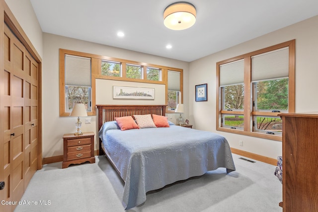 carpeted bedroom featuring a closet