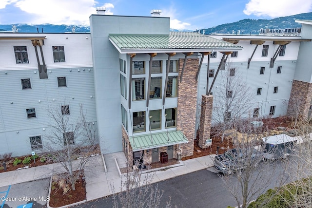 view of building exterior featuring a mountain view