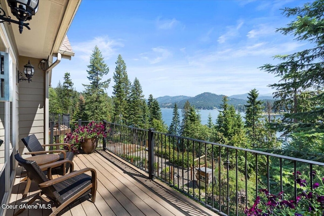 deck featuring a water and mountain view