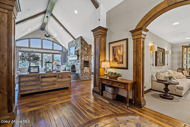 hallway featuring beamed ceiling, high vaulted ceiling, dark hardwood / wood-style floors, and ornate columns