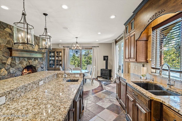 kitchen featuring sink, decorative light fixtures, and plenty of natural light