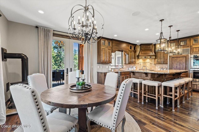 dining area featuring dark hardwood / wood-style flooring and sink