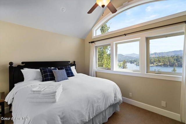 carpeted bedroom featuring ceiling fan, a water and mountain view, and lofted ceiling