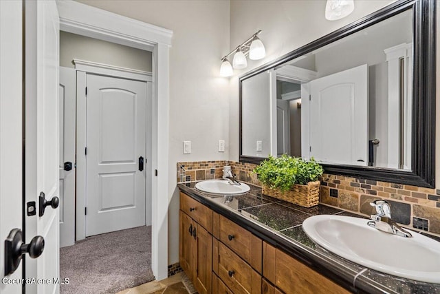 bathroom featuring tasteful backsplash and vanity