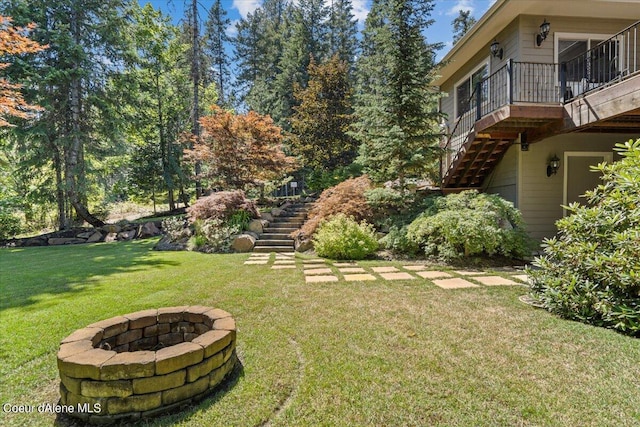 view of yard with an outdoor fire pit