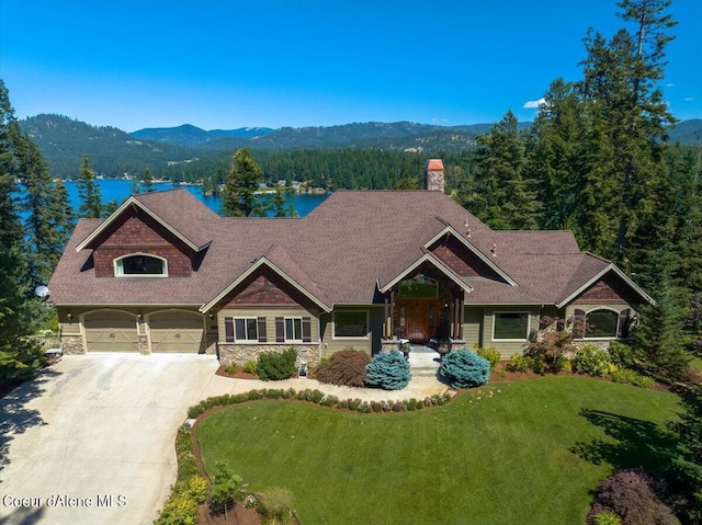 craftsman-style house with a mountain view and a front lawn