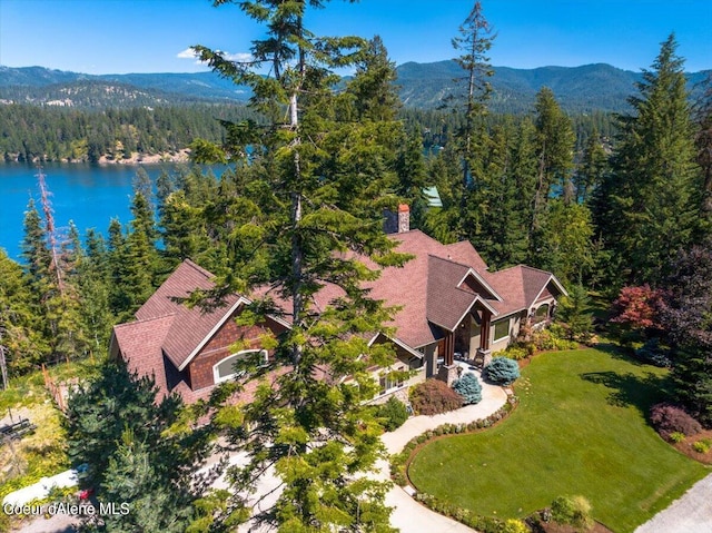 birds eye view of property featuring a water and mountain view