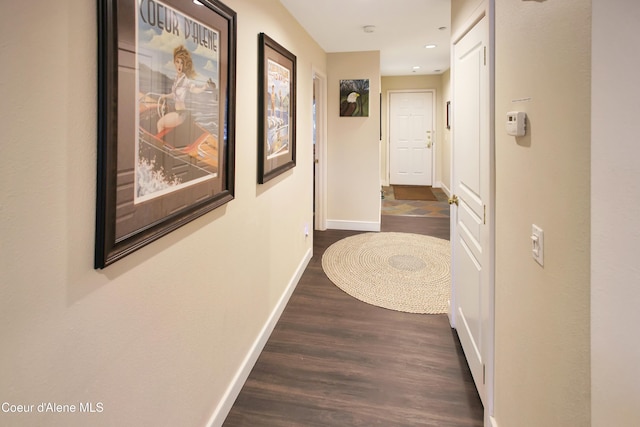 corridor with recessed lighting, dark wood-style flooring, and baseboards