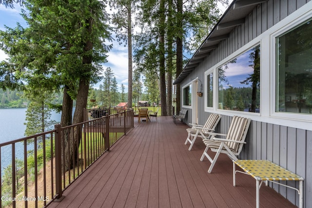 wooden deck featuring a water view