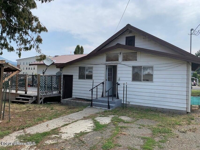 view of front of property with a wooden deck