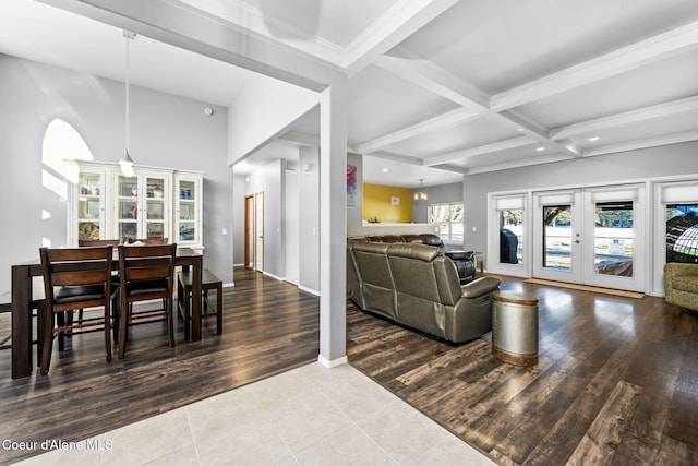 living room featuring beamed ceiling, coffered ceiling, tile patterned flooring, and french doors