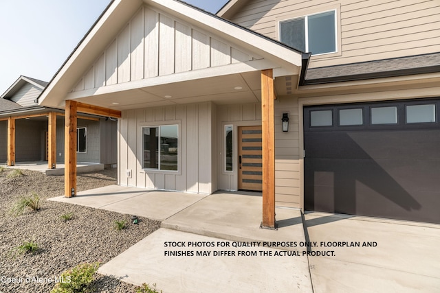 doorway to property with a garage