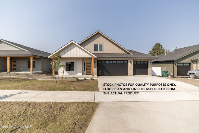 view of front facade featuring a garage and a front lawn