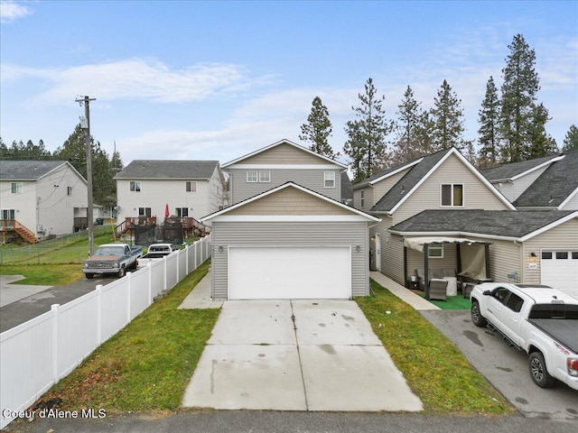 view of property with a front yard and a garage