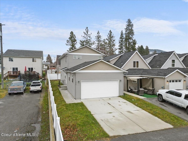 view of front property featuring a front yard and a garage