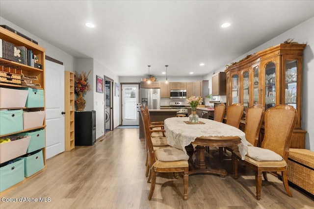 dining room with light wood-type flooring