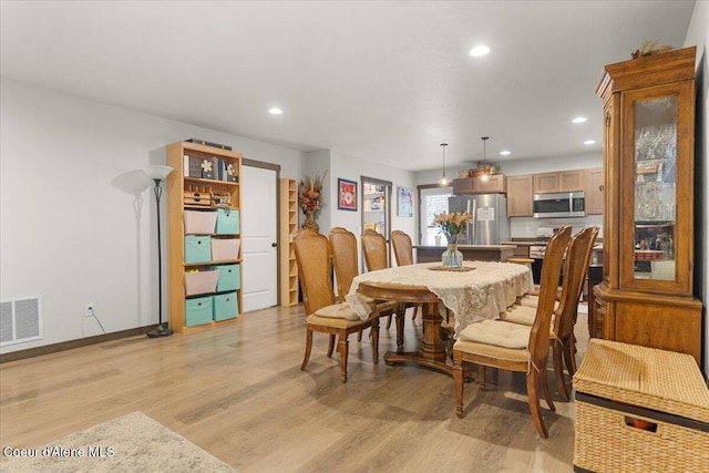 dining room featuring light wood-type flooring