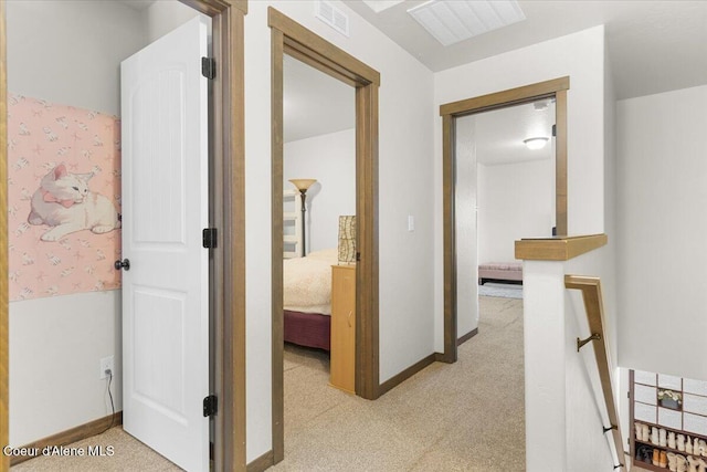 hallway featuring light carpet