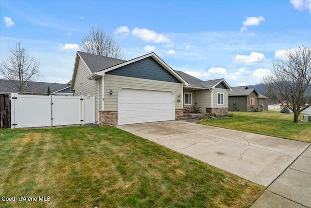 view of front of property with a front yard and a garage