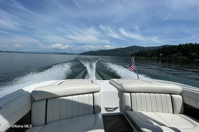 view of dock featuring a water and mountain view