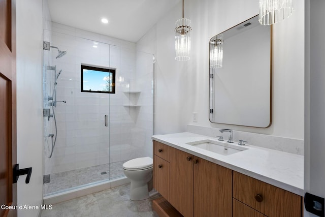 bathroom featuring vanity, toilet, walk in shower, and an inviting chandelier