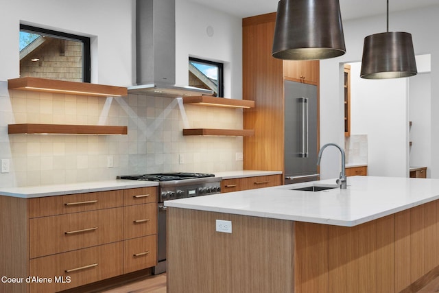 kitchen with decorative backsplash, high end appliances, exhaust hood, pendant lighting, and plenty of natural light