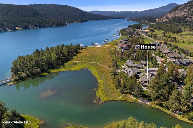 aerial view featuring a water and mountain view