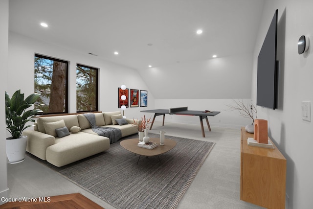 living room featuring vaulted ceiling