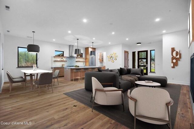 living room featuring hardwood / wood-style floors and a healthy amount of sunlight