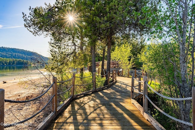 view of property's community featuring a water and mountain view