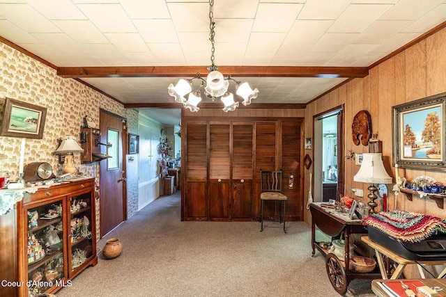 2834 W Conkling Rd, Worley, ID 83876 - living area featuring a chandelier, carpet, beam ceiling, wooden walls, and ornamental molding