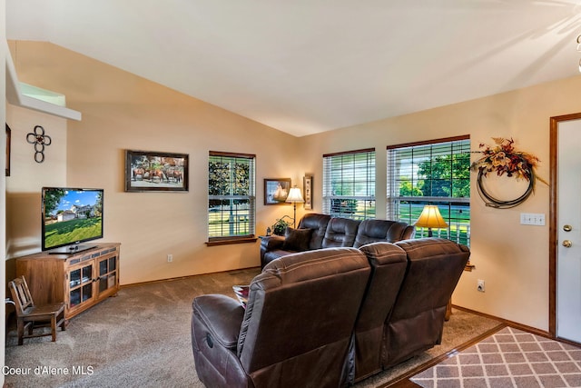 carpeted living room featuring lofted ceiling