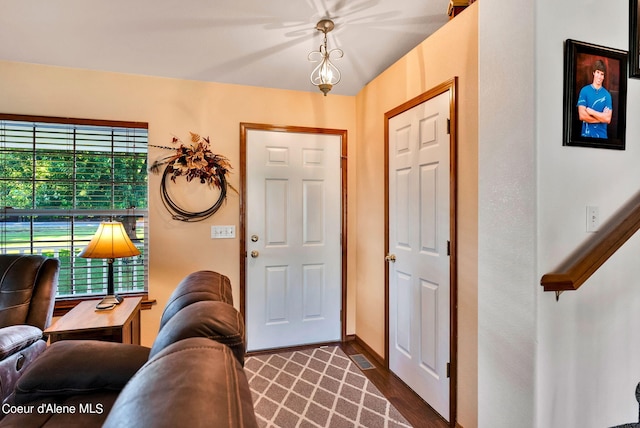 foyer entrance with dark hardwood / wood-style floors