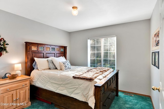 bedroom featuring dark carpet