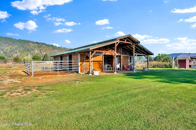 view of stable featuring a mountain view