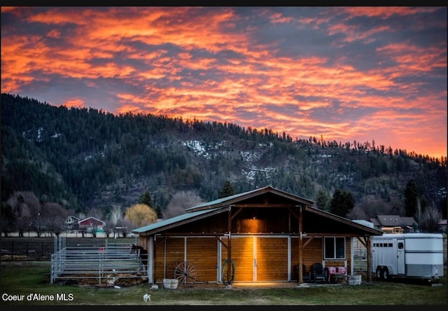 exterior space featuring an outbuilding and a mountain view