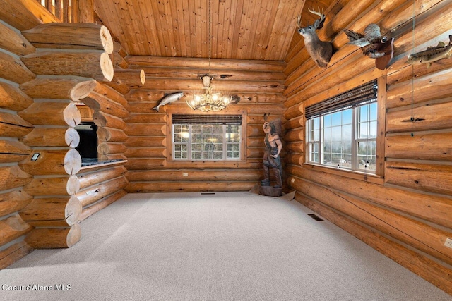 carpeted empty room featuring wooden ceiling, log walls, and a chandelier