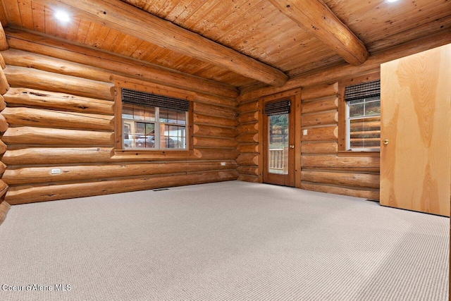 empty room featuring beamed ceiling, wood ceiling, and rustic walls