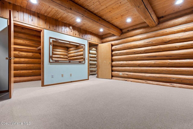 carpeted empty room featuring rustic walls, beamed ceiling, and wooden ceiling