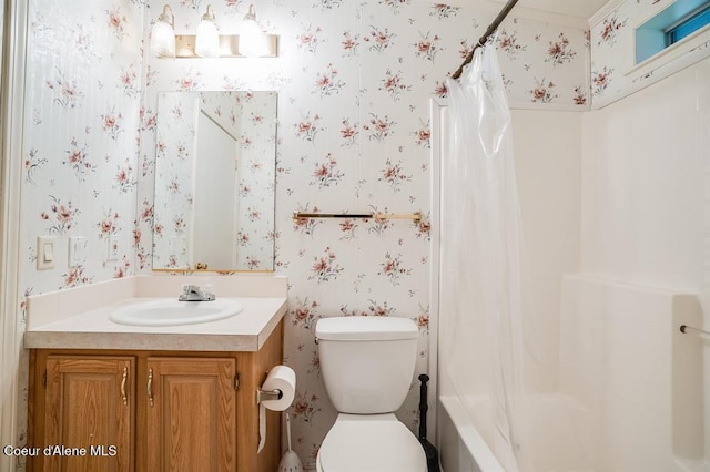 full bathroom with vanity, shower / bath combo, and toilet